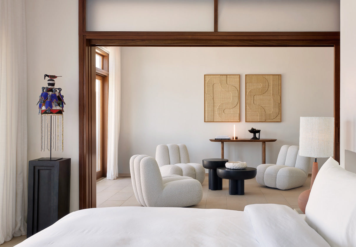 A bedroom from the Amirandes resort showing 3 toe chairs in off white, a Podium and 2 crown tables from 101 Copenhagen a