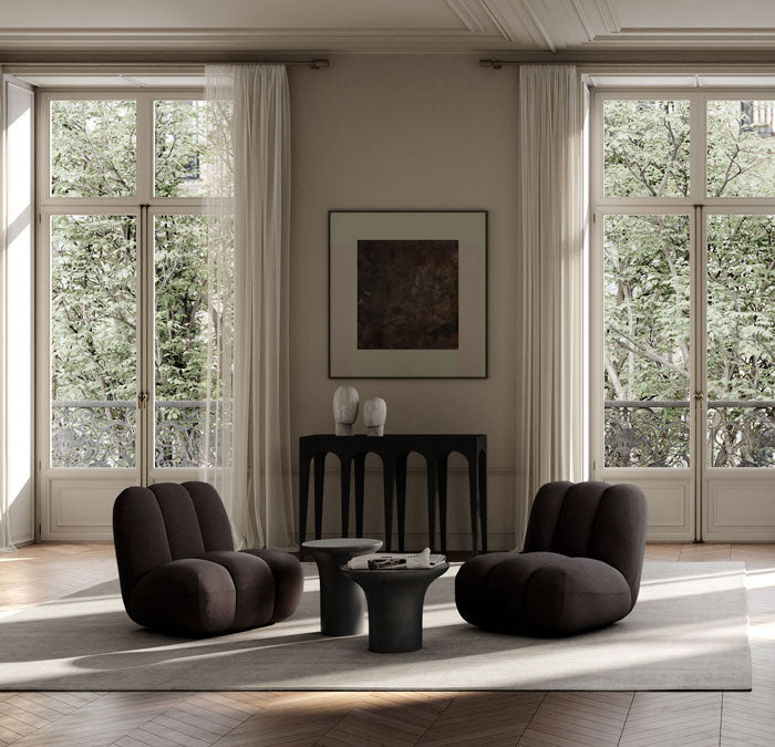 Dark Brown Toe chairs, Trumpet tables and a Bow console with Head scultptures