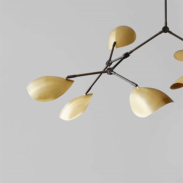 Modern Stingray chandelier with Brass lampshades on a gray background
