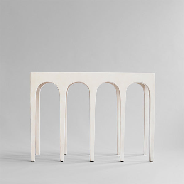 Minimalist Birch white Bow Console with arch-shaped legs on a light gray background