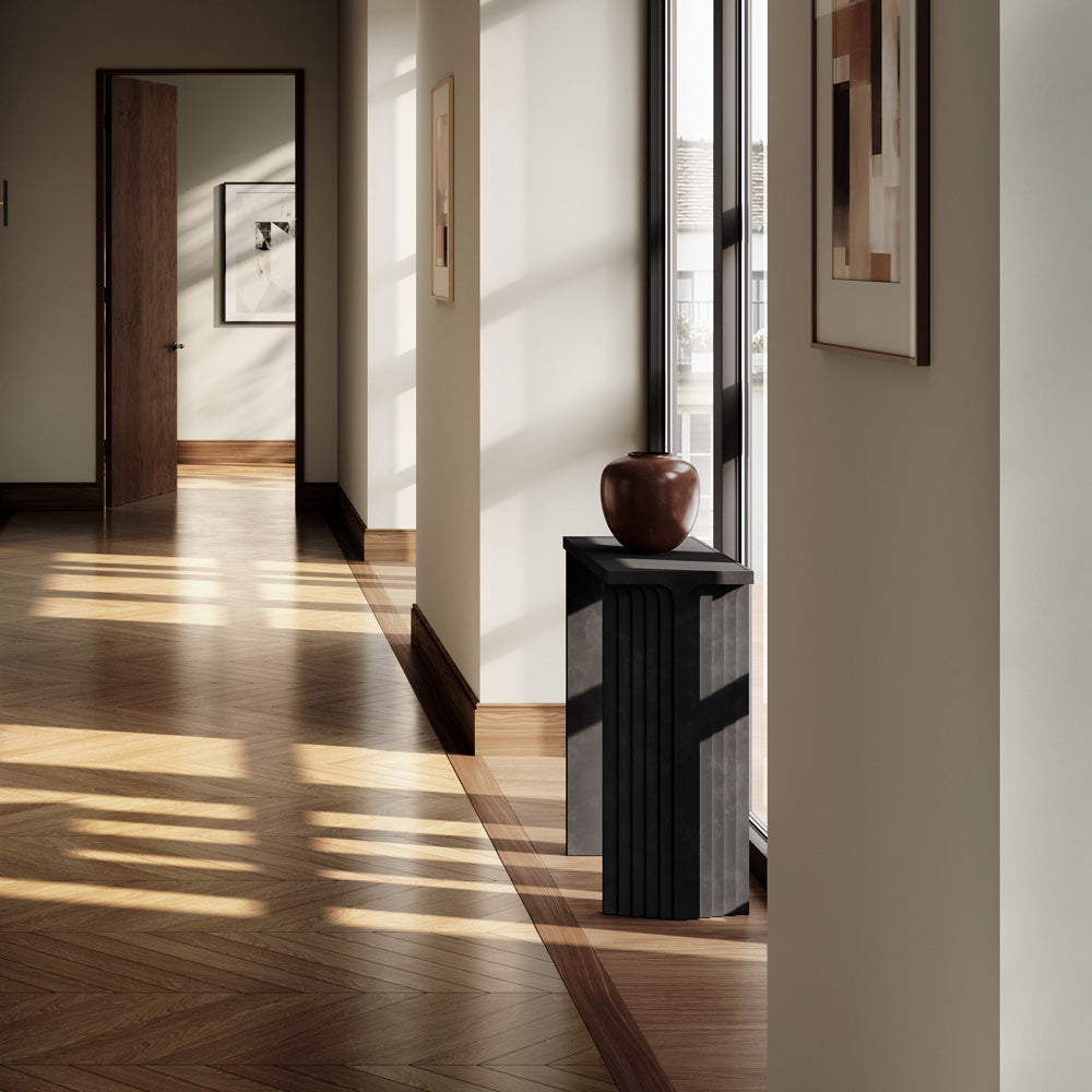 Modern interior with a Sunao vase Mini in Maroone on a Arc console by a large window.