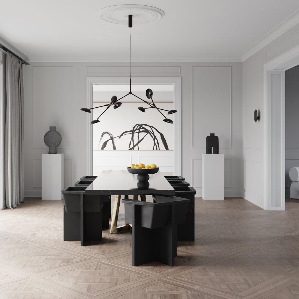 Dining room with Brutus dining chairs, Baburu Bowl, Sphere and Cobra vases, Drop chandelier and Clam wall lamp