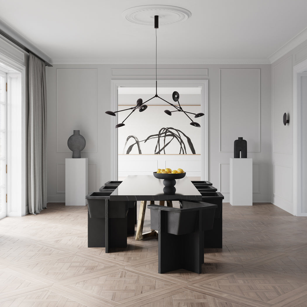 Dining room with Brutus dining chairs, Baburu Bowl, Sphere and Cobra vases, Drop chandelier and Clam wall lamp