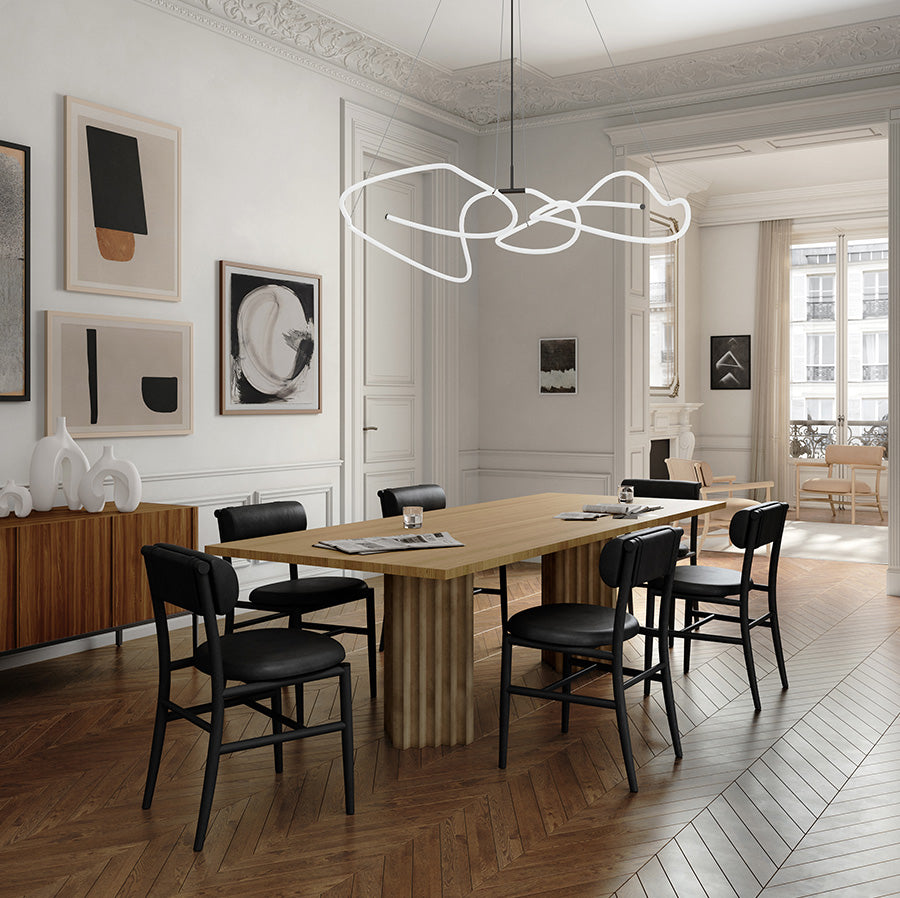 101 Copenhagen diningroom with ARc dining table, Nama chairs, Ni vases, and Ghost chandelier in neon.