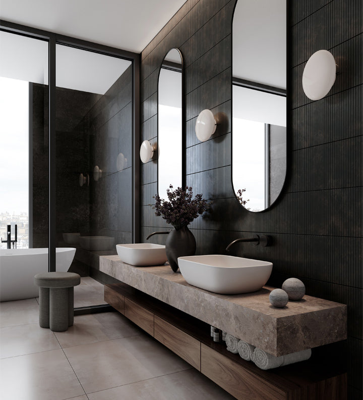 Modern bathroom with black walls, white sinks, and Hikari Wall lamps.