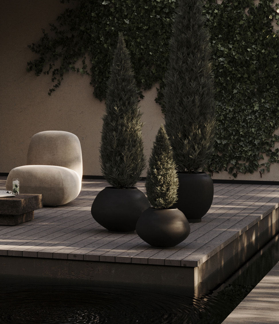 Decorative outdoor setting with Suano Plant pots and Toe Chair and Toe Chair