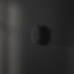 101 Copenhagen Clam Wall Lamp - Oxidized turned on and off