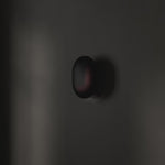 101 Copenhagen Clam Wall Lamp -  Burned Black turned on and off