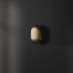 101 Copenhagen Clam Wall Lamp -  Brass turned on and off