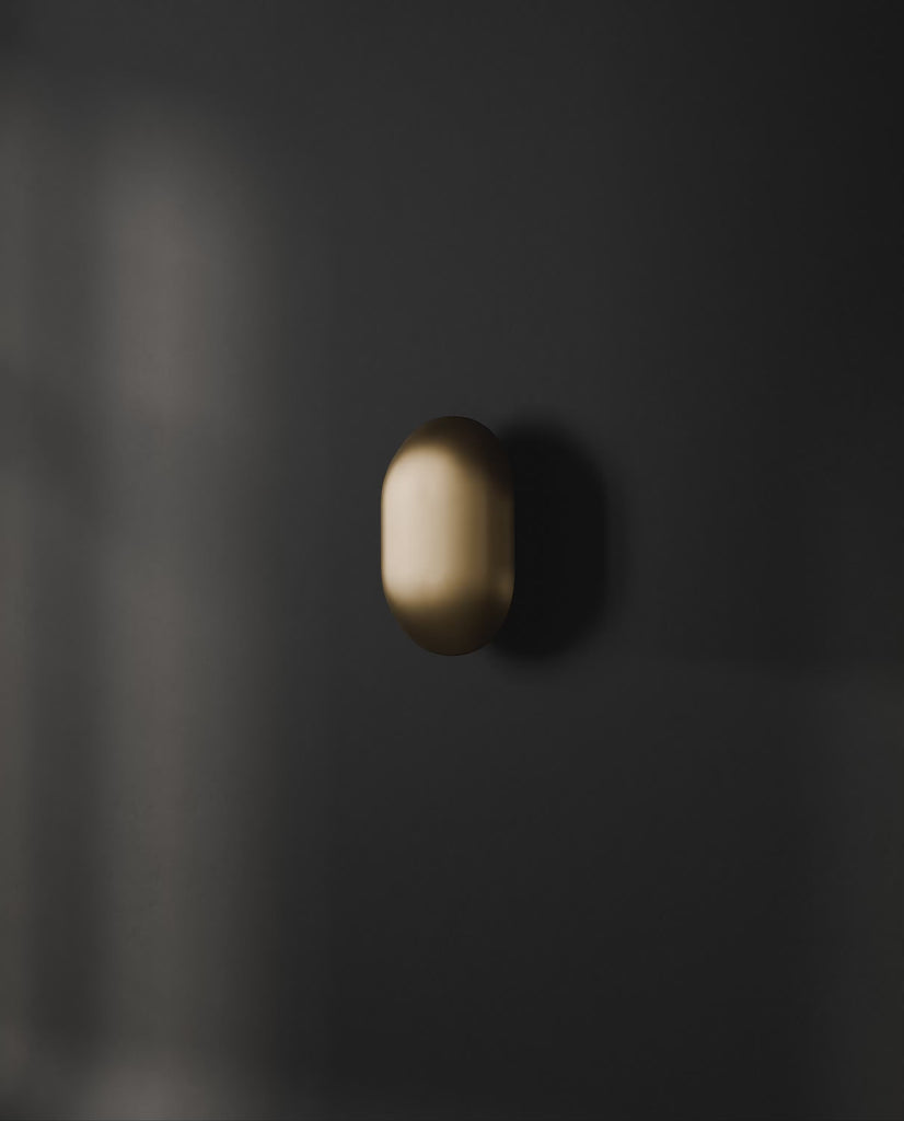 101 Copenhagen Clam Wall Lamp -  Brass turned on and off